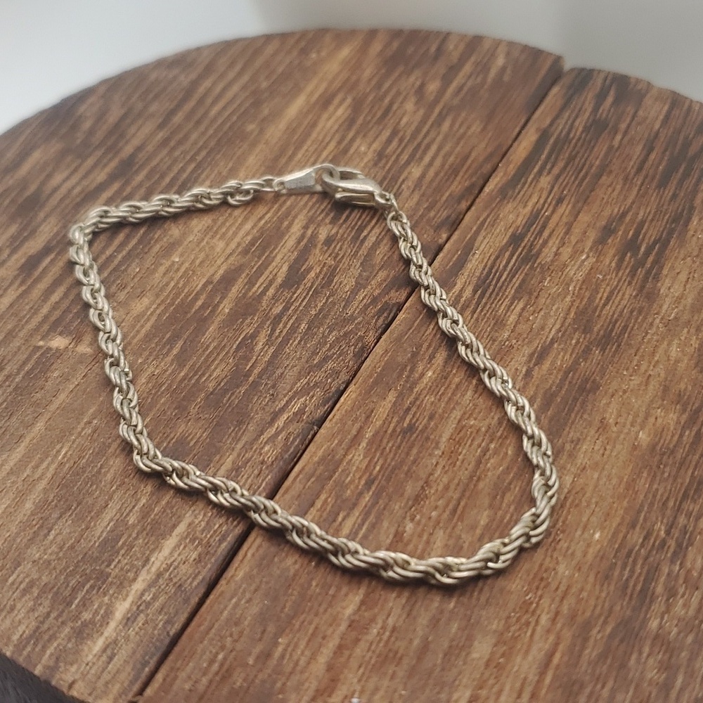 B2124 silver tone braided bracelet signed‎